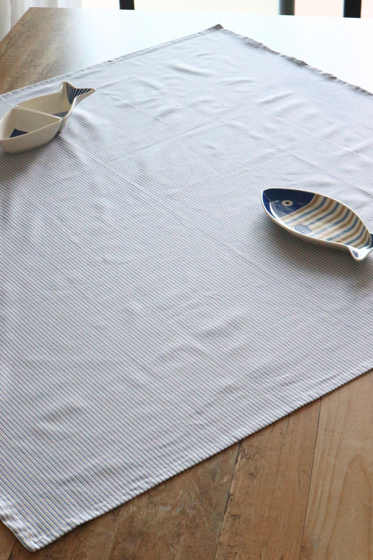 Nuvole di Stoffa Glauco Glauco - Tovaglietta a forma di conchiglia bianca e azzurra | Nuvole di Stoffa